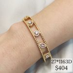 BRAZALETE CON FIGURAS AL CENTRO DE PIEDRAS CZ