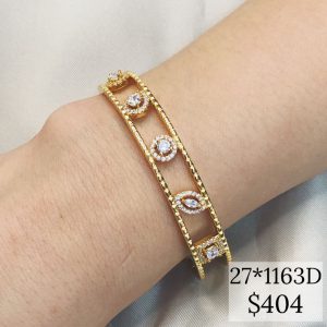 BRAZALETE CON FIGURAS AL CENTRO DE PIEDRAS CZ