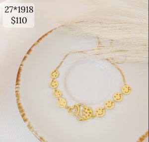 PULSO AJUSTABLE DE CARITAS CON DIJE DE CORAZON