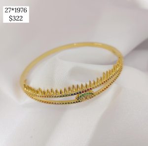 PULSO RIGIDO DIENTITOS CON CENTRO OJO Y BRILLOS COLORES