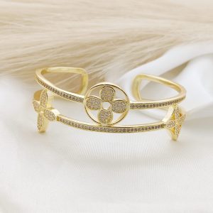 BRAZALETE RIGIDO DOS LINEAS PAVE CON FLORES EN DISCO Y ROMBOS