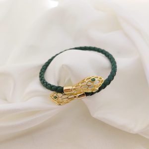 PULSO PIEL CON CABEZAS DE SERPIENTE OJOS VERDES
