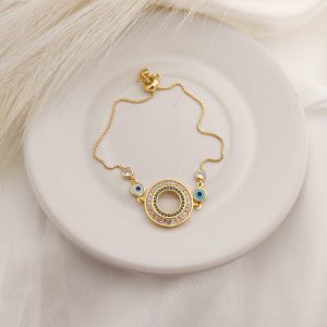 PULSO AJUSTABLE CON ARO DE CZ Y CAD CON OJOS