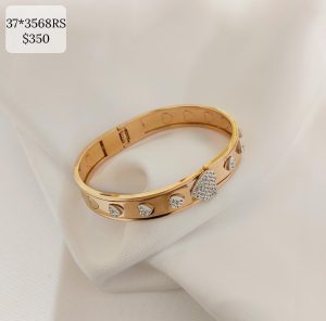 PULSO ANCHO RIGIDO CON CORAZON BRILLOS