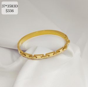 PULSO LISO CON COSTURAS Y LINEA BRILLOS