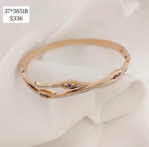 PULSO ARO DOS LINEAS ENTRELAZADAS CON OJOS Y CRISTALES