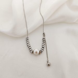 COLLAR MULTI CUADRITOS Y PERLA AL CENTRO